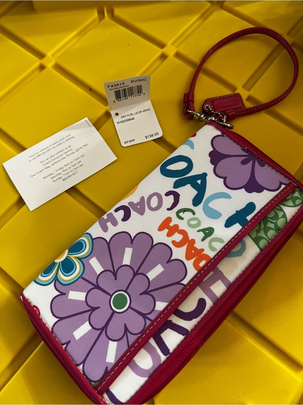 Coach Floral Logo Wristlet in Purple, Pink & Green